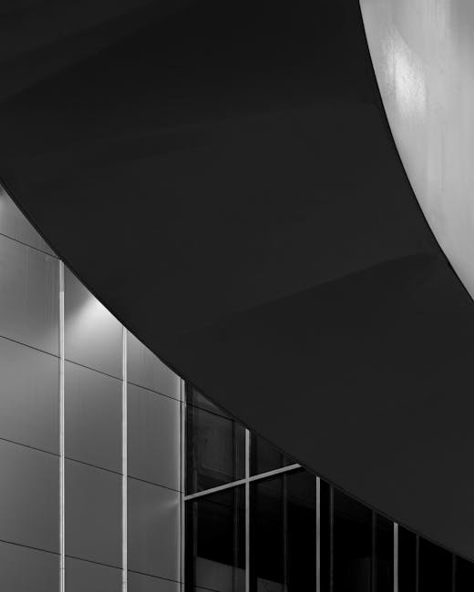 Modern hotel architecture featuring sleek grey lines and lighting