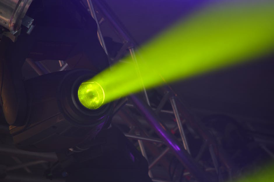 Green laser beam in a dark event space